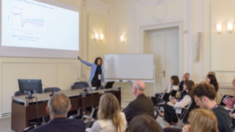 Woman presenting in classroom. 